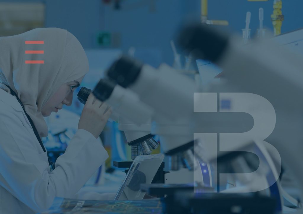International researcher working in a modern UK laboratory